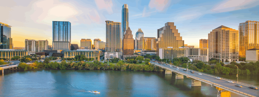 Aerial view of downtown Austin, Texas skyline and Lady Bird Lake, representing the Austin community served by West Holistic Medicine.